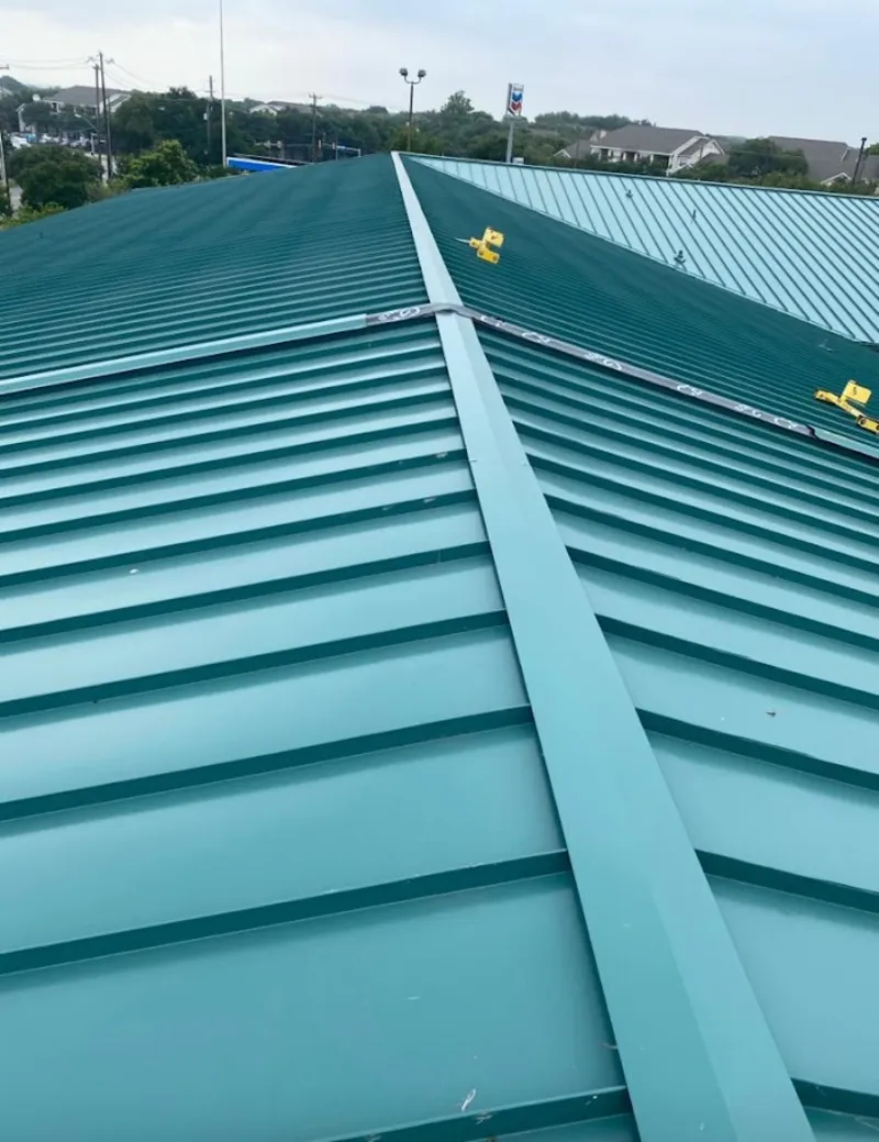 Green commercial metal roof ridge and valley for Metal Roof Repair in Duxbury
